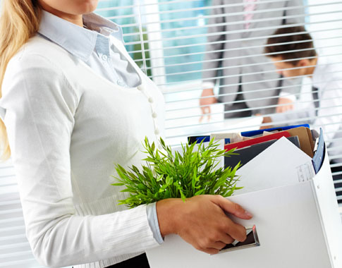Woman carrying a box of documents